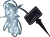 A white LED light string with a solar panel and stake. Produktbild-Vorschau