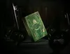 A green and gold deck of playing cards titled 'Wicked' is displayed upright, surrounded by several large, antique-looking keys in a dimly lit setting. Náhled obrázku produktu