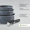 A stack of dark gray pots and pans with white speckles, and a detachable handle. Text overlays describe product features and a warranty. Voir les images du produit