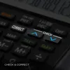 A close-up view of a calculator's buttons, highlighting the 'CORRECT' and 'CHECK' buttons. Voir les images du produit