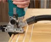 A person is using a router on a wooden surface. Voir les images du produit