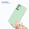 A hand holding a light green phone case against a white and light gray background. Produktbild-Vorschau
