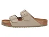 A side view of a beige Birkenstock sandal on a white background. Produktbild-Vorschau