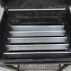 Inside view of a grill with multiple metal heat shields or flavorizer bars stacked inside. Anteprima dell’immagine prodotto