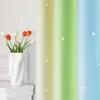 A vase of tulips sits on a white shelf next to a gradient curtain with stars. Produktbild-Vorschau