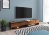 A modern living room with a TV stand and a large television. Náhľad obrázku produktu