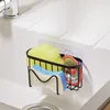 A sink caddy holding sponges and a drain stopper. Produktbild-Vorschau