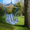 A striped hammock chair hangs from a tree in a grassy yard. Anteprima dell’immagine prodotto