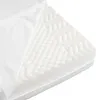 Close-up of a white foam mattress with a textured surface and a partially open white cover. Podgląd zdjęcia produktu