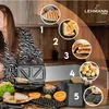 A woman in a kitchen with a sandwich maker and various food items. Anteprima dell’immagine prodotto