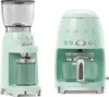 Two Smeg kitchen appliances, a coffee grinder and a coffee maker, are shown side-by-side against a white background. Náhled obrázku produktu