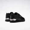 A pair of black Reebok sneakers with silver accents on a white background. Voir les images du produit