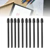 A top-down view of ten black stylus pen nibs arranged in a row against a white background. Above them, a blurred image shows a tablet displaying a diagram, pencils, and architectural drawings. Náhled obrázku produktu