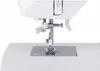 A close-up view of the needle and presser foot area of a white sewing machine. Anteprima dell’immagine prodotto