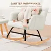 A person is sitting in a beige rocking chair with their feet up. Náhľad obrázku produktu