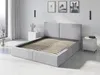 A modern bedroom with a grey upholstered bed frame and slatted base. Produktbild-Vorschau