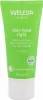 A product shot of a green tube of Weleda Skin Food Light moisturizer. Voir les images du produit