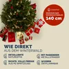 A Christmas tree surrounded by gift boxes, with marketing text and a product size indicator. Náhled obrázku produktu