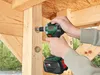 A person is using a Bosch cordless impact driver to fasten a bolt into a wooden structure. Náhľad obrázku produktu