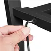 A hand is using an Allen wrench to tighten a screw on a black metal structure. Produktbild-Vorschau