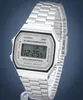 A close-up studio shot of a silver Casio digital watch. Voir les images du produit