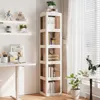 A tall, white, rotating bookshelf filled with books and decorative items, placed in a room with a desk and window. Anteprima dell’immagine prodotto