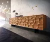 A modern living room with a stylish wooden sideboard, a spiral staircase, and decorative elements. Produktbild-Vorschau