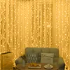 A cozy living room scene with a sofa, pillows, and a table, decorated with string lights. Produktbild-Vorschau