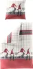 A flat lay image of a duvet cover and pillowcase set with a gnome and plaid pattern. Produktbild-Vorschau