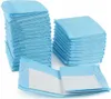 Stacks of blue disposable absorbent pads. Produktbild-Vorschau