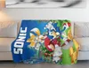 A Sonic the Hedgehog themed blanket draped over a couch. Voir les images du produit