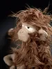 A close-up shot of a stuffed monkey toy with messy brown fur and a sad expression. Náhled obrázku produktu