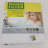 A product box for a MANN FILTER cabin air filter, featuring an image of a woman driving. Produktbild-Vorschau