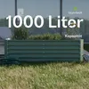A green metal raised garden bed filled with plants, placed outdoors on grass with a hose coiled nearby. Produktbild-Vorschau