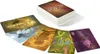 A stack of Dixit cards with several cards spread out in front of it. Náhled obrázku produktu