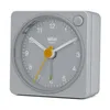 A close-up studio shot of a gray Braun analog alarm clock against a white background. Produktbild-Vorschau