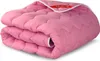 A folded pink comforter is shown against a white background. Anteprima dell’immagine prodotto
