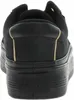 The back view of a black Tommy Hilfiger sneaker with a platform sole. Náhled obrázku produktu