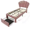 A pink upholstered bed frame with a slatted base and a pull-out drawer, shown against a white background. Podgląd zdjęcia produktu