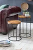 Two wooden and metal side tables are placed next to a burgundy leather sofa. Náhled obrázku produktu
