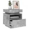 A concrete-effect nightstand with a drawer and open shelf, decorated with a potted plant and a framed picture. Produktbild-Vorschau