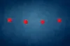 A string of four red star-shaped lights hangs against a dark blue background. Produktbild-Vorschau