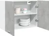 An open wall cabinet with concrete-look doors, showing stacked plates and bowls inside. Produktbild-Vorschau