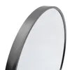 A close-up, angled view of the edge of a round mirror with a black frame. Produktbild-Vorschau