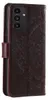 A close-up, side view of a dark brown flip phone case with an embossed mandala pattern. Produktbild-Vorschau