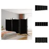 A bedroom scene with a bed and a black room divider. Voir les images du produit