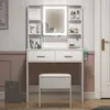 A well-lit vanity set with a stool in a room. Náhled obrázku produktu