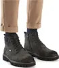 A close-up shot of a person wearing brown trousers and dark grey boots. Náhled obrázku produktu