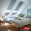 A bedroom with skylights and a bed. Produktbild-Vorschau