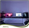 A gaming setup with multiple monitors, computers, and decorative wall panels. Podgląd zdjęcia produktu